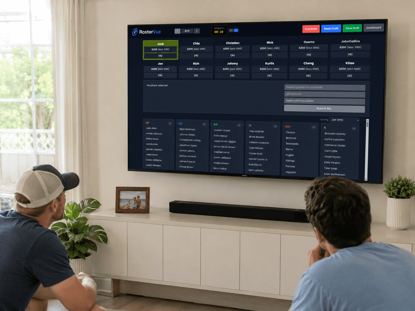 RosterVue digital draft board showing a live fantasy football auction draft room on a TV screen